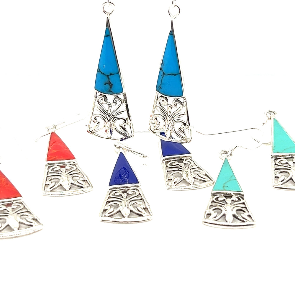 
                  
                    Super Silver's Long Triangle Filigree Earrings with Inlaid Stone feature nature-inspired beauty with turquoise and blue stones, exuding bohemian charm.
                  
                