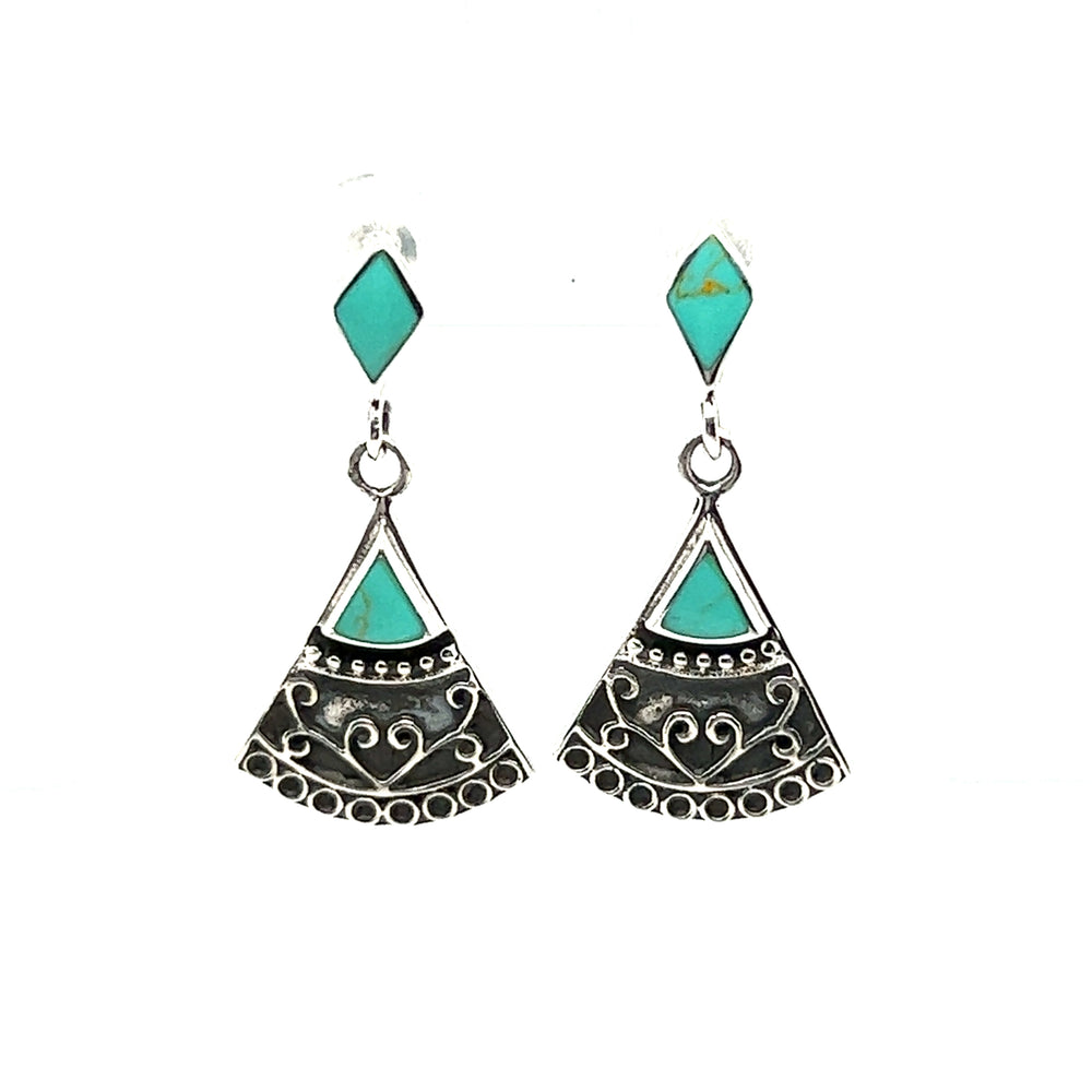 
                  
                    A pair of Bohemian Style Filigree earrings with inlay turquoise stones and a geometric design by Super Silver.
                  
                