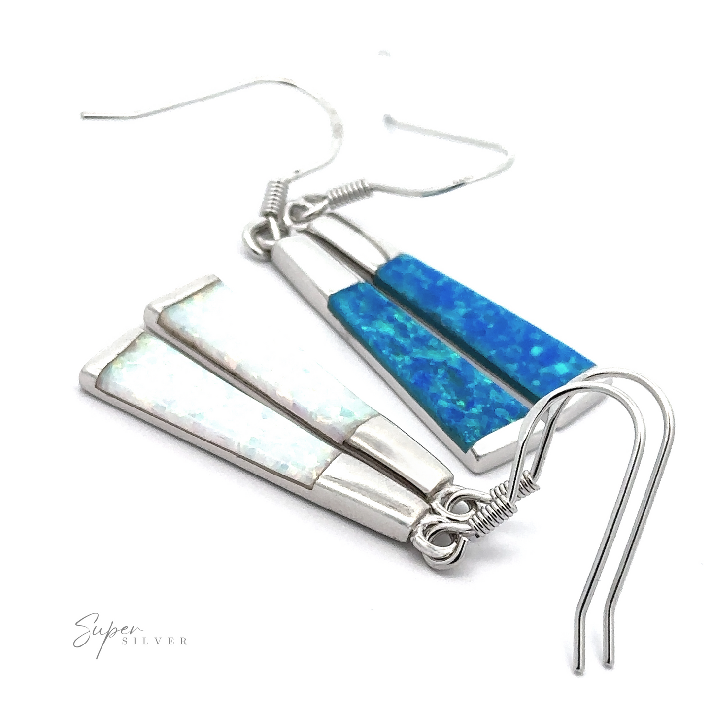 Close-up of two pairs of Elegant Long Opal Earrings, one adorned with blue inlay and the other showcasing white lab-created opal. Perfect for the contemporary artsy woman, these stylish pieces feature the "Super Silver" logo in the bottom left corner.