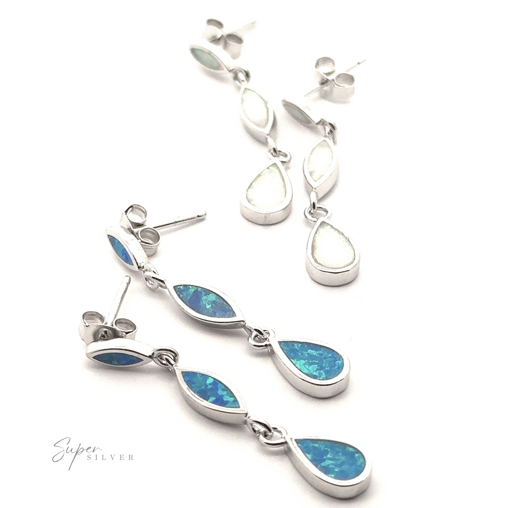 
                  
                    Two pairs of dangle earrings with teardrop-shaped blue and white gemstones set in sterling silver, laid out on a white background, along with a "Super Silver" logo in the bottom left corner. One pair features Elegant Lab-Created Opal Earrings that shimmer beautifully.
                  
                