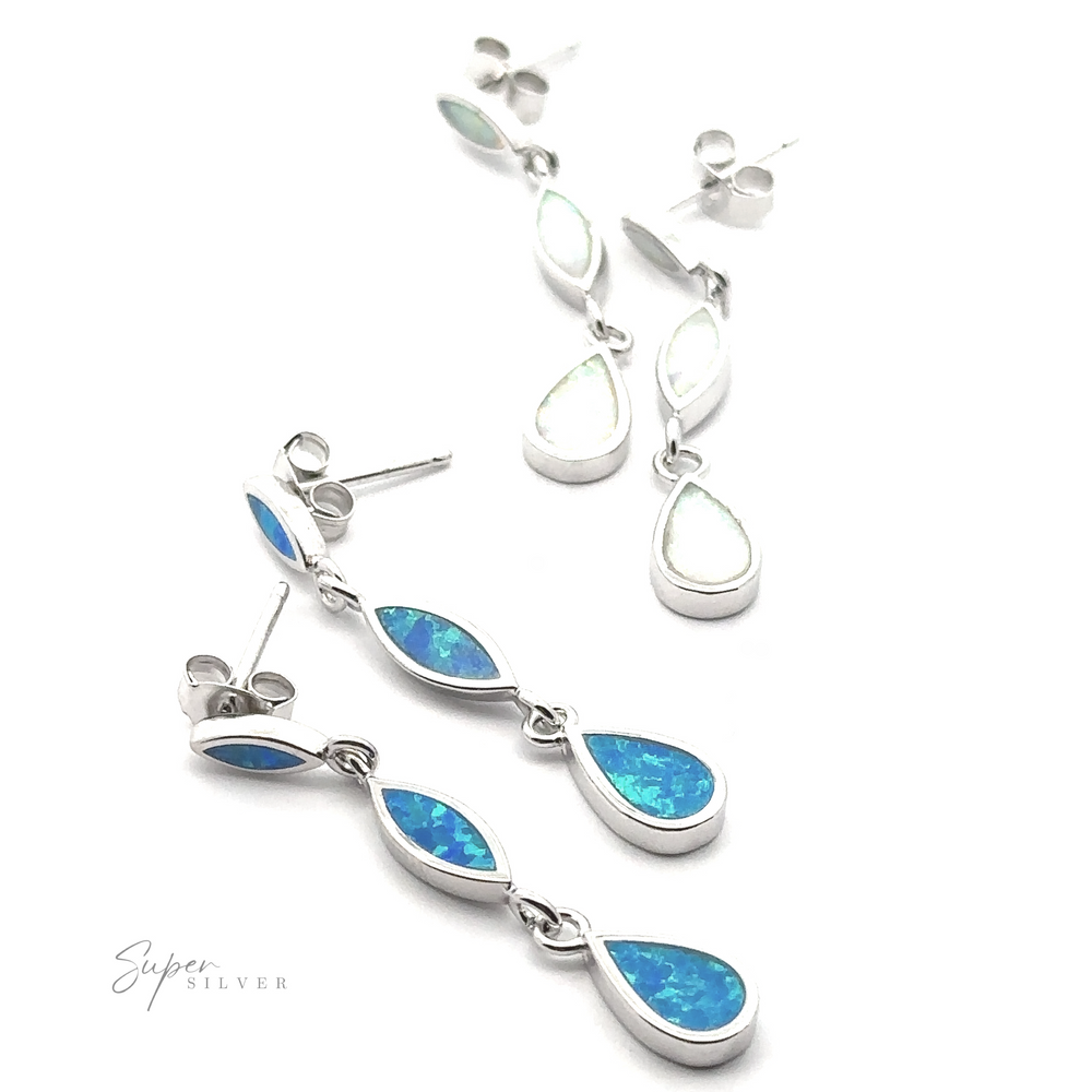 
                  
                    Two pairs of Elegant Lab-Created Opal Earrings are shown, each featuring three teardrop-shaped stones. One pair displays blue lab-created opals, while the other showcases white stones. The brand name "Super Silver" is visible in the corner.
                  
                