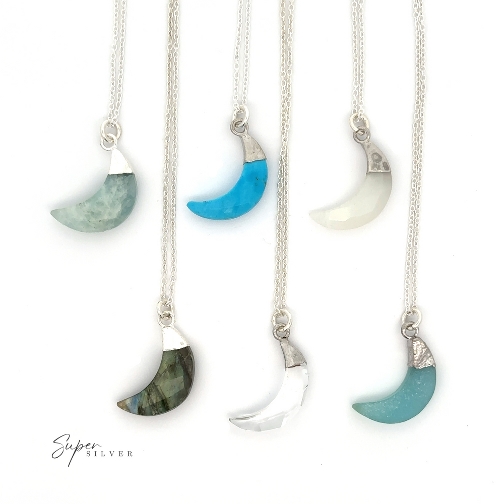 A collection of Delicate Stone Moon Necklaces adorned with a variety of gemstone charms, including moonstones.
