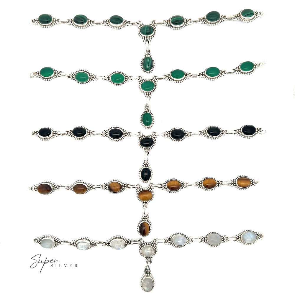 This Gemstone Y-Necklace with Beaded Border features a delicate chain and a single gemstone drop pendant. The pendant is available with green, blue, and black stones. Each gemstone is carefully selected for the Gemstone Y-Necklaces with Beaded Border.