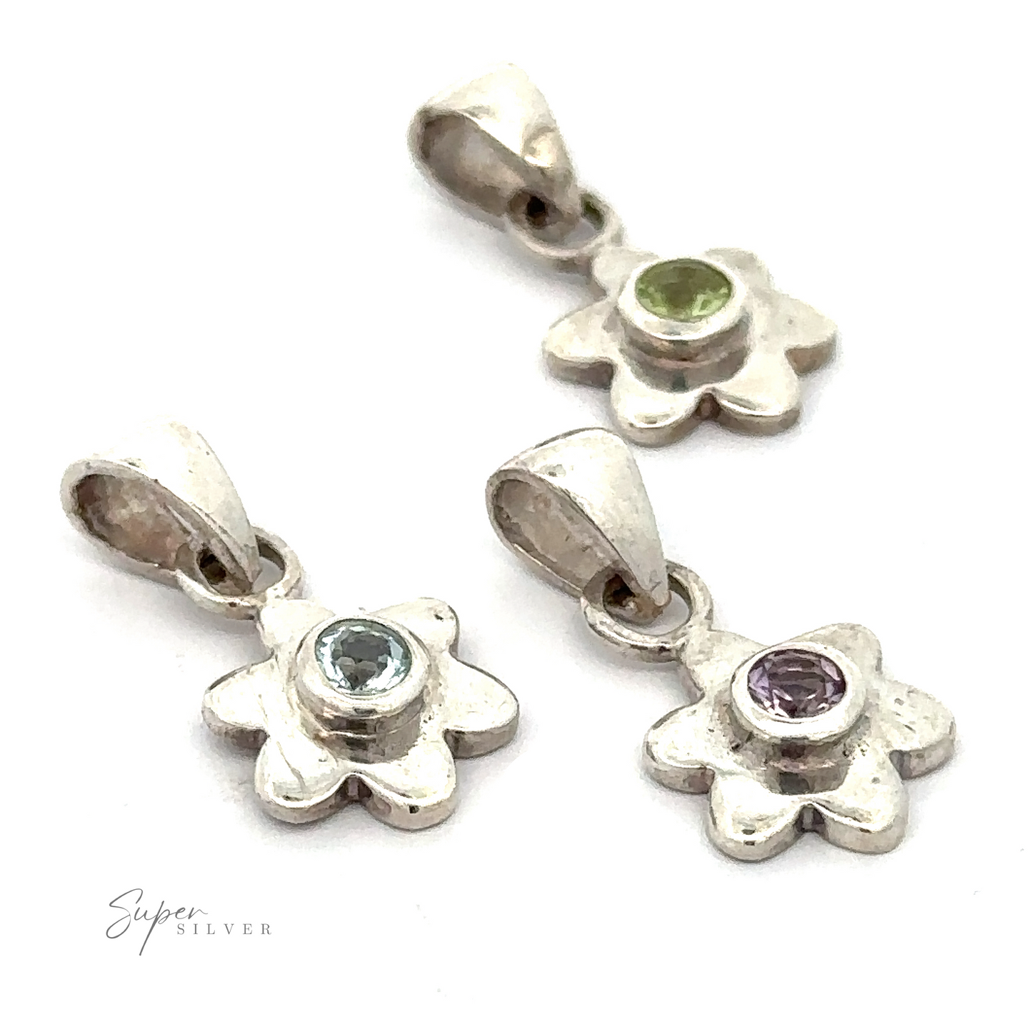 
                  
                    Three Tiny Gemstone Flower Pendants, each featuring a unique gemstone center in green, light blue, and purple, arranged on a white background.
                  
                