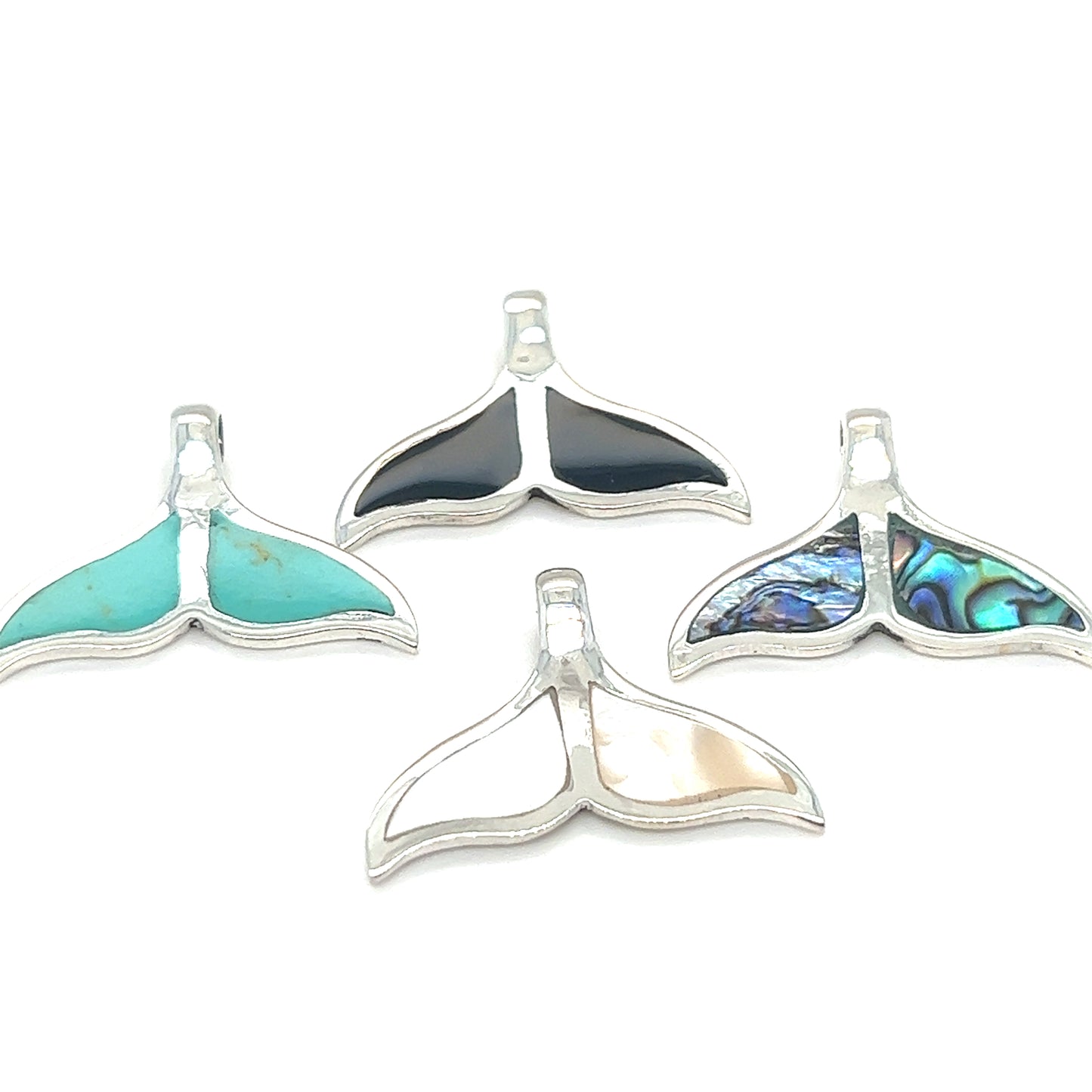Four Super Silver Inlay Whale Tail Pendants with turquoise stones, evoking the beauty of the ocean.