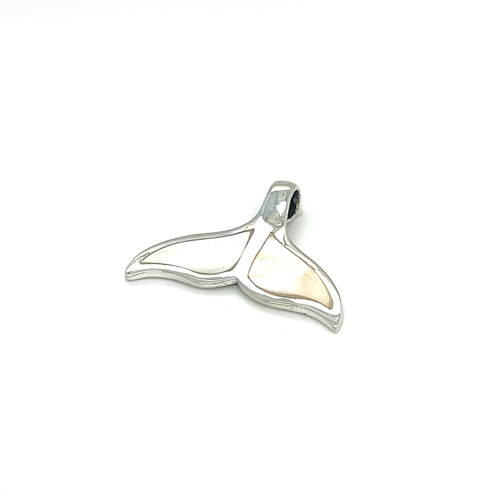 
                  
                    A Super Silver inlay whale tail pendant on a white background in Santa Cruz.
                  
                