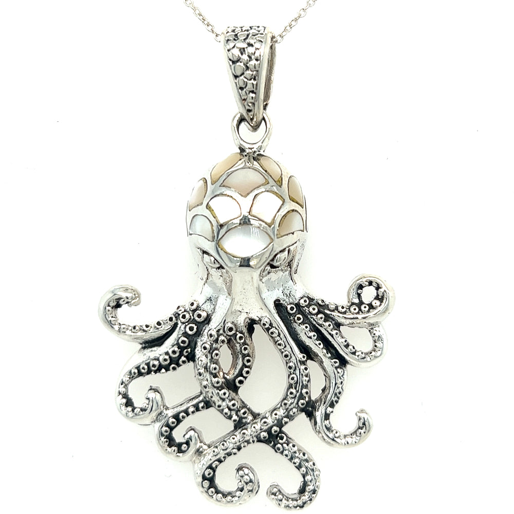
                  
                    A Super Silver Statement Octopus Pendant adorned with inlay stone details on a silver chain.
                  
                