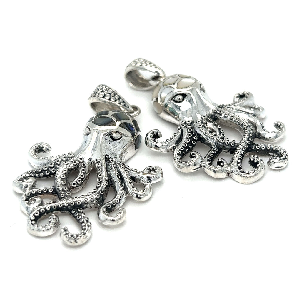 Two Super Silver Statement Octopus Pendants with Inlay Stone details on a white background.