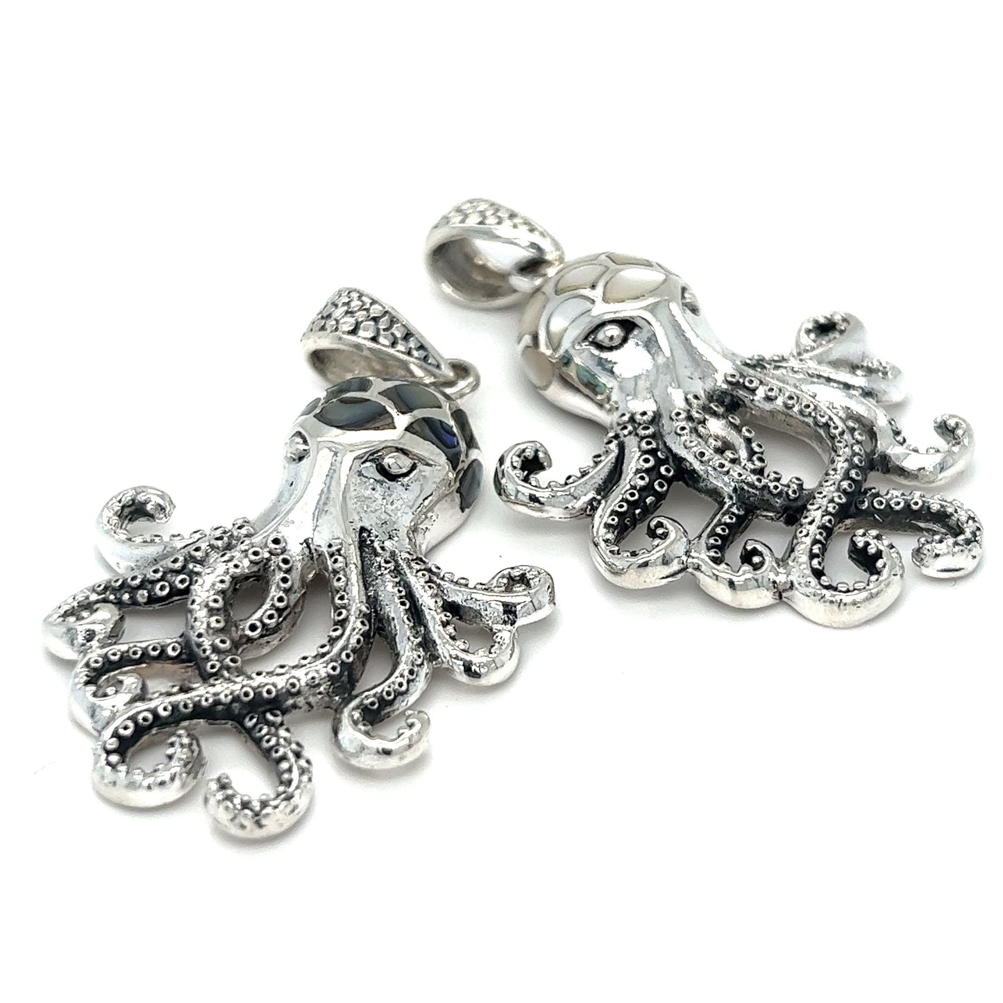 Two Super Silver Statement Octopus Pendants with Inlay Stone details on a white background.