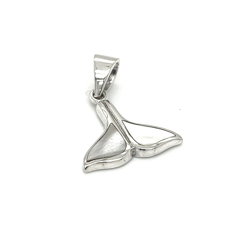 
                  
                    A Simple Whale Tail Pendant with Inlay Stones from Super Silver on a white background, symbolizing ocean conservation.
                  
                
