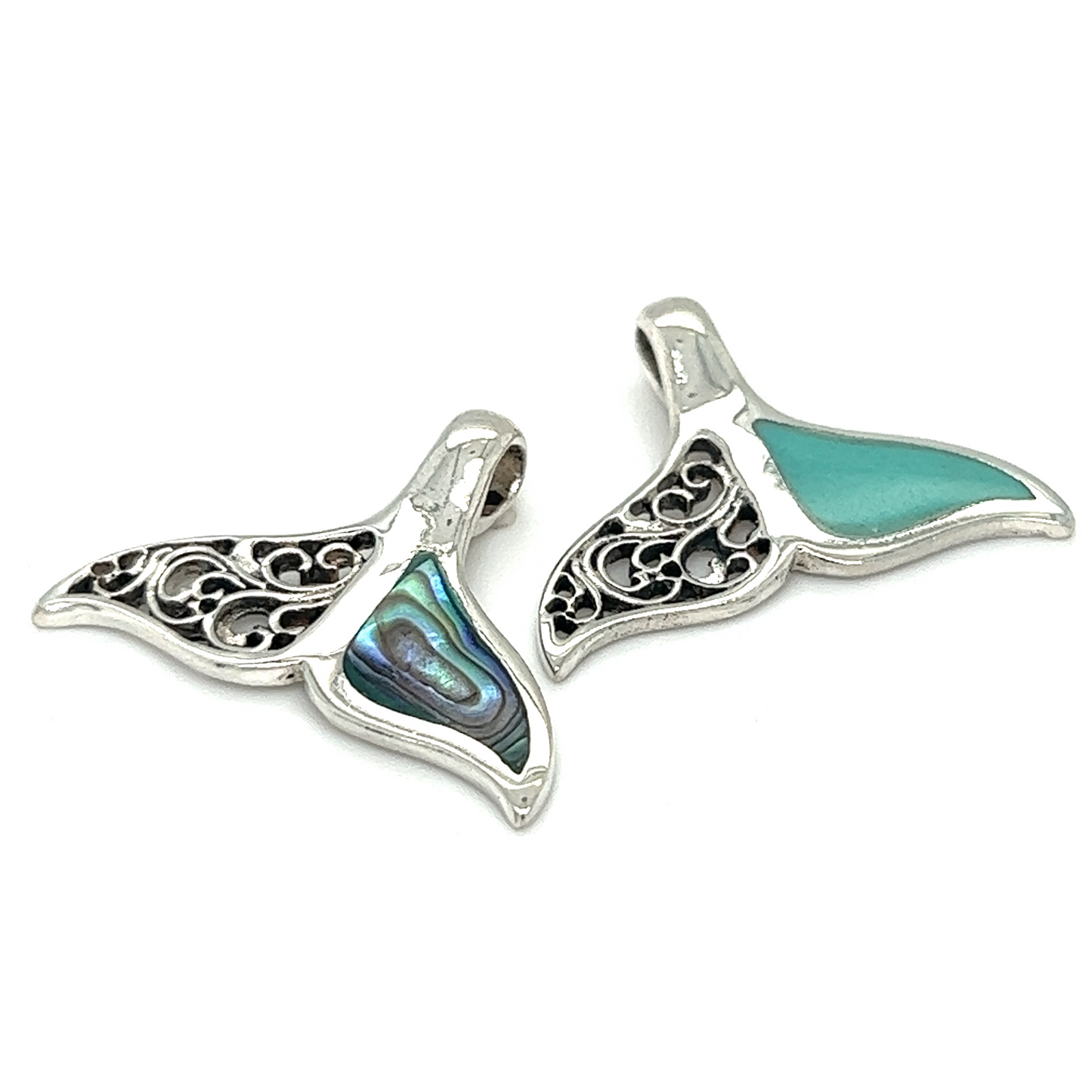
                  
                    Two Half Filigree Whale Tail Pendants showcasing ocean conservation on a white background.
                  
                