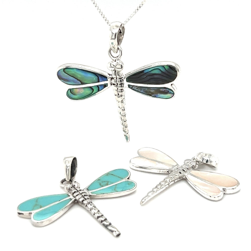 Three Dragonfly Inlay Stone Pendants by Super Silver on a white background.