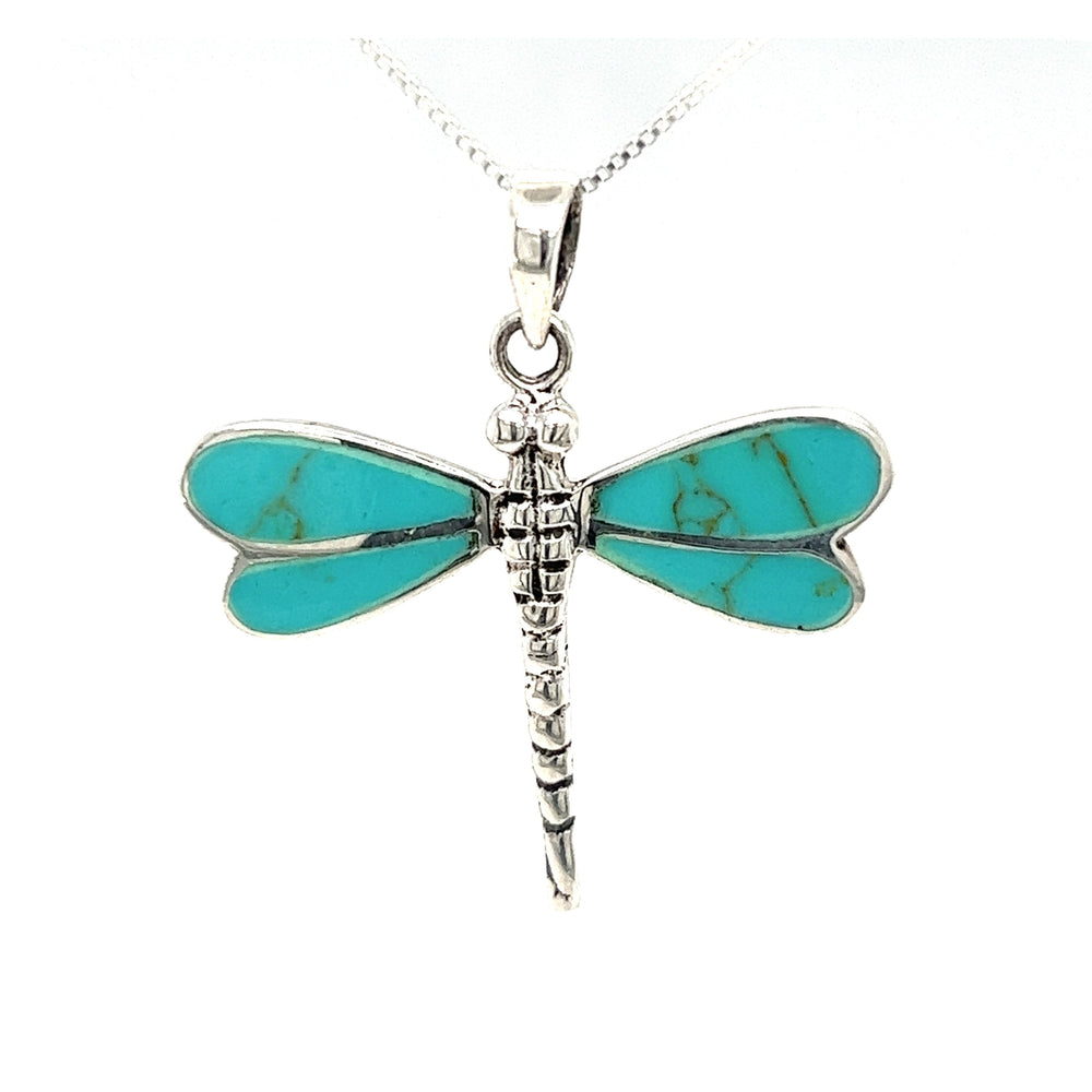 
                  
                    A Dragonfly Inlay Stone Pendant with a turquoise stone on a Super Silver chain.
                  
                