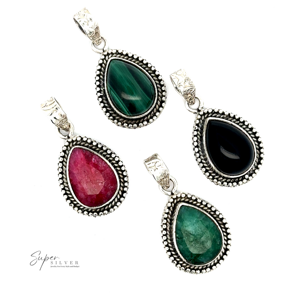 Four Teardrop Stone Pendant With Bead Design necklaces with ornate Bali beaded design in sterling silver settings. The pendants, featuring green, black, pink, and another green stone, are beautifully arranged on a white background.