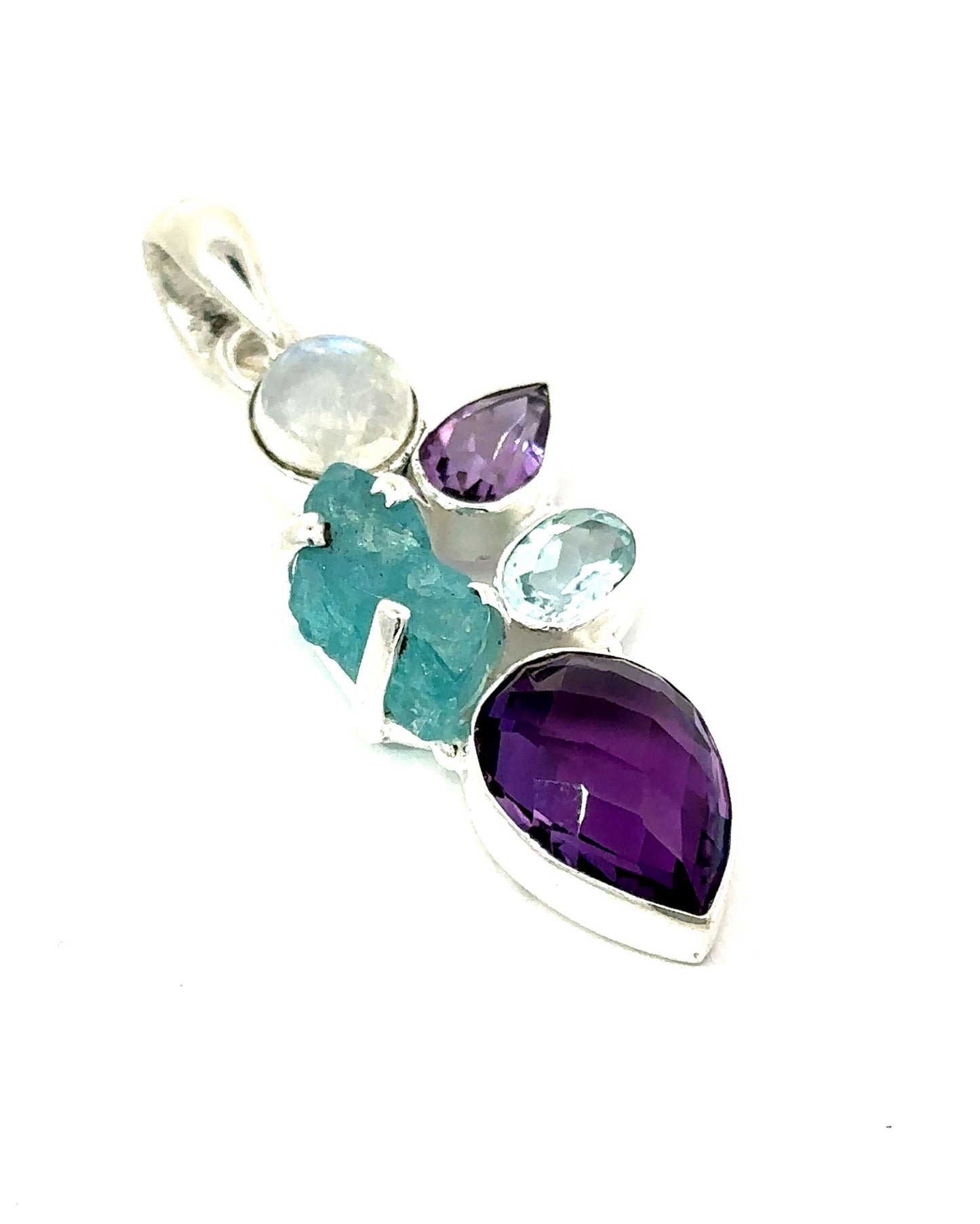 
                  
                    The Amethyst Multi Stone Pendant is a bohemian jewelry piece featuring a striking silver design adorned with a cluster of mixed gemstones, including amethyst tones and blue and turquoise stones in various shapes and sizes.
                  
                