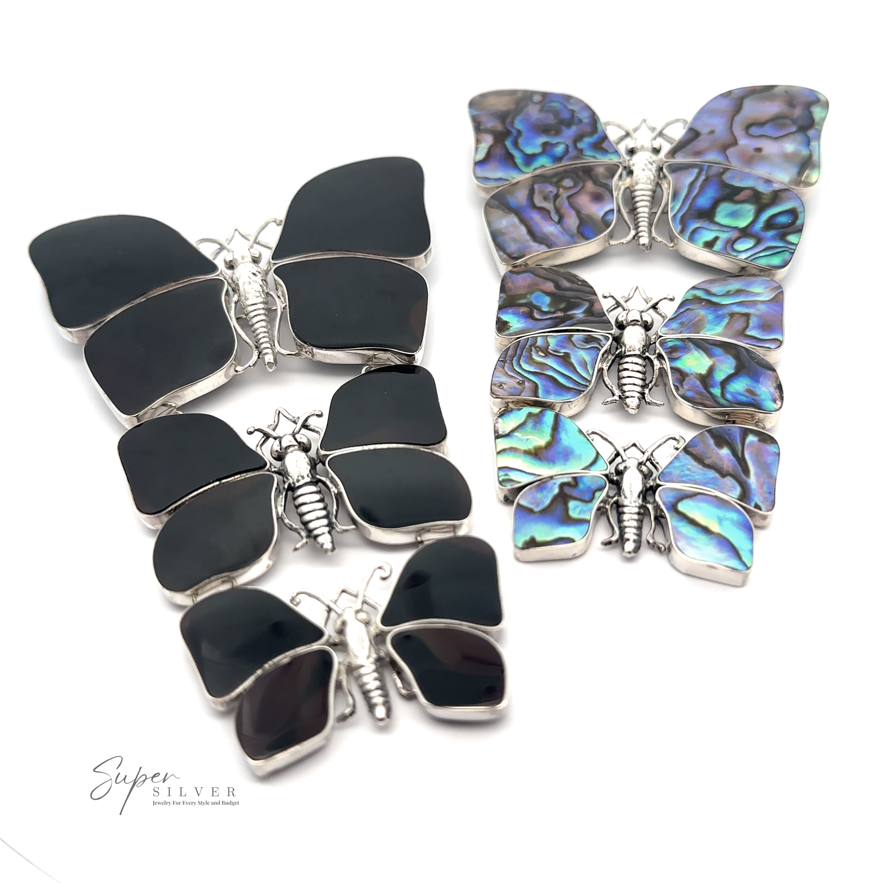 A collection of Statement Pendant or Brooch with Three Butterflies perfect for any nature lover. The left ones feature black wings, while the right ones boast iridescent, colorful wings with sterling silver bodies. A "Super Silver" logo is in the bottom left corner.