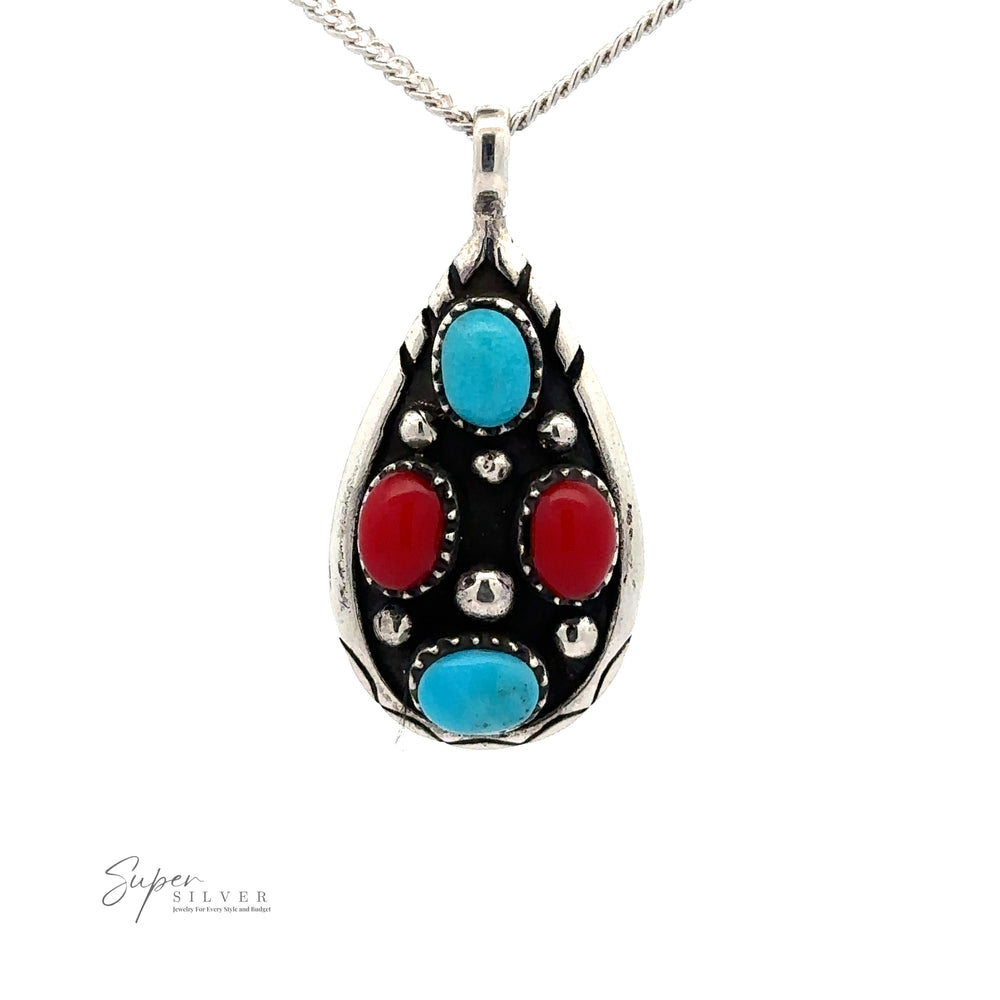 
                  
                    A Teardrop Turquoise and Coral Pendant with two blue turquoise stones and two red stones on a silver chain. The intricate metalwork showcases a silver teardrop-shaped design. The logo "Super Silver" is visible in the bottom left corner.
                  
                