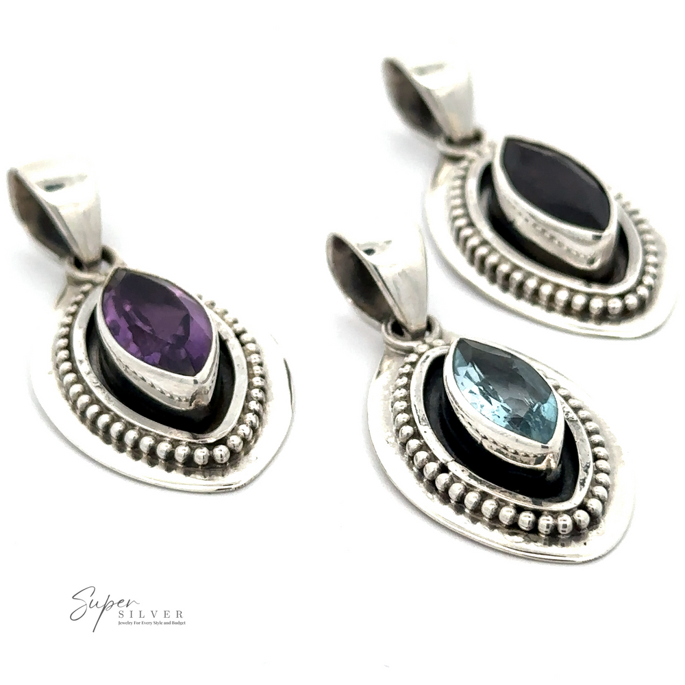 Three Beautiful Marquise Pendants With Beaded Design, featuring elongated oval gemstones in purple Amethyst, dark blue, and light blue Blue Topaz, each set within two concentric metal frames adorned with small beads.
