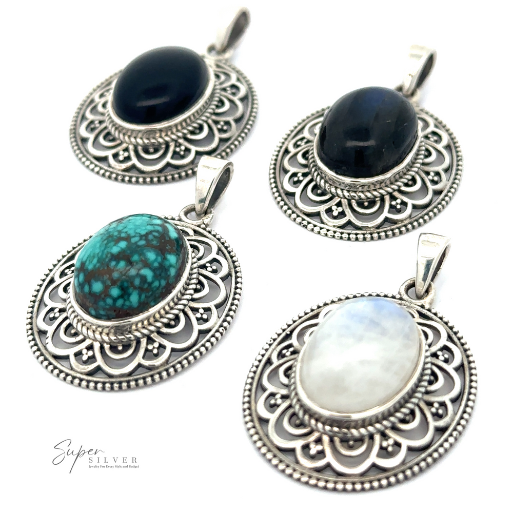 Four Oval Stone Pendants with Filigree Border with different semi-precious stones are displayed. The stones, including labradorite and moonstone, are black, blue-green, white, and dark blue. The pendants feature intricate filigree designs.