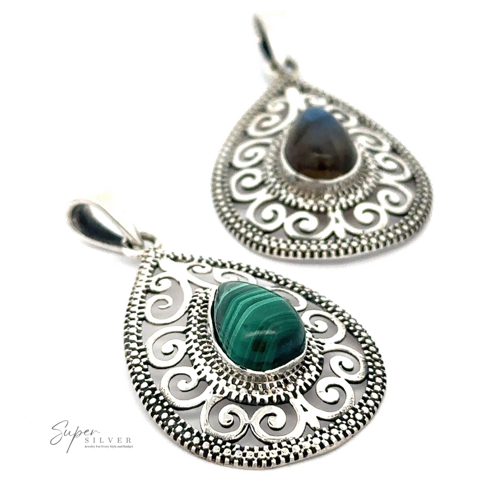 
                  
                    Two intricately designed earrings featuring central Gemstone Teardrop Pendant with Swirls.
                  
                
