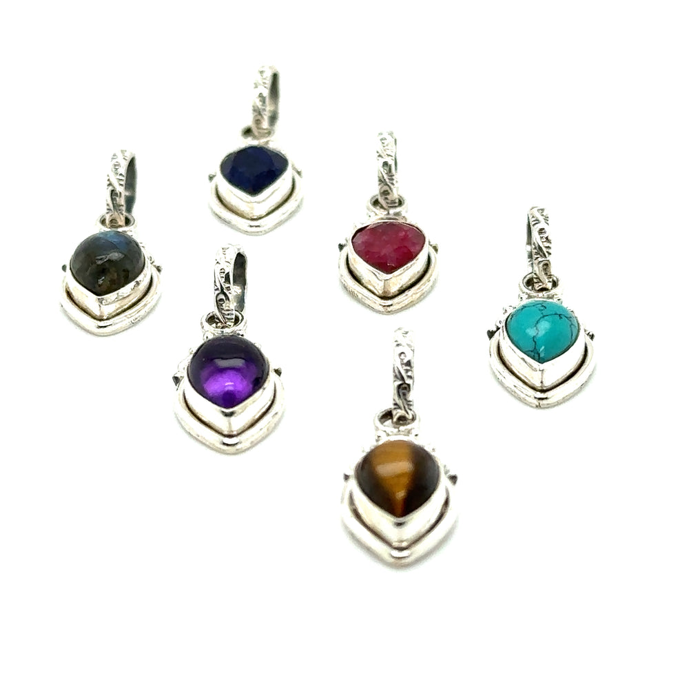 A collection of Dainty Gemstone Teardrop Pendants, exuding free-spirited elegance, displayed on a white background.