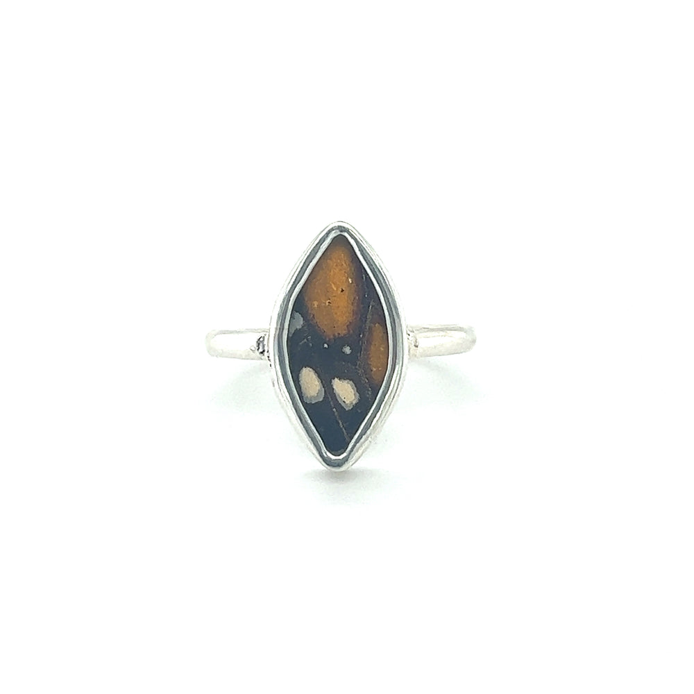 
                  
                    A sustainable fashion statement, the Genuine Butterfly Wing Ring in Marquise Shape features a black and brown stone.
                  
                