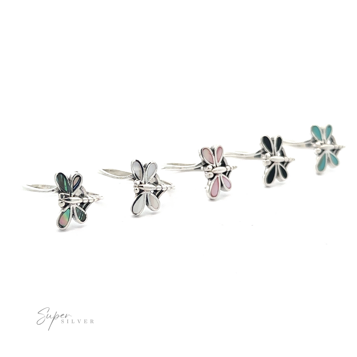 A display of four Inlaid Stone Dragonfly rings, crafted from .925 Sterling Silver with varied enamel finishes including Abalone Mother of Pearl, Turquoise, and Onyx.