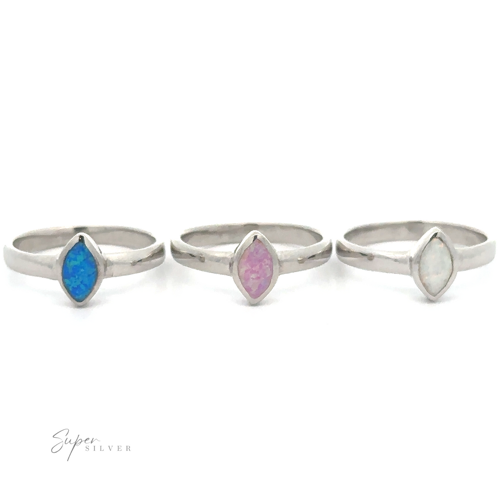 
                  
                    Three silver Simple Marquise Shaped Opal Rings displayed against a white background.
                  
                