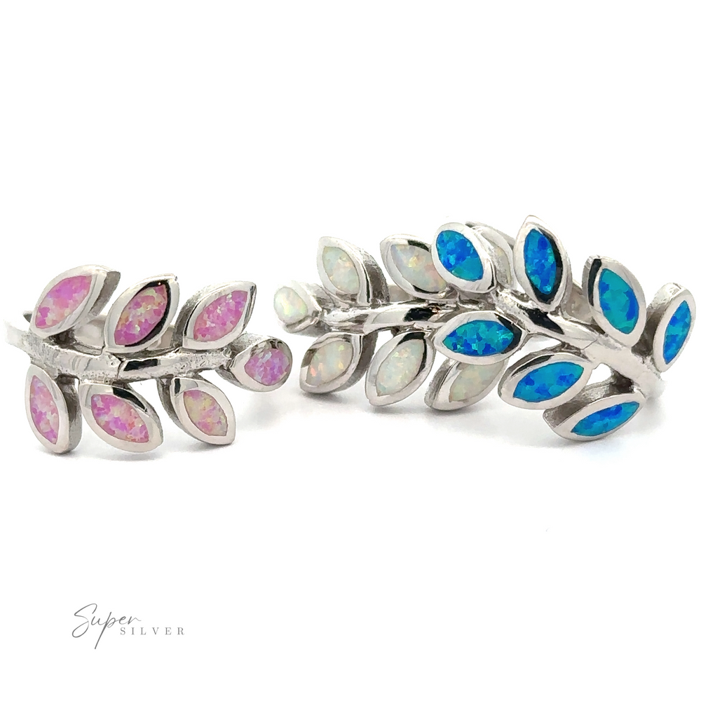 Two sterling silver Lab-Created Opal Fern Rings with blue and pink lab-created opal inlays.