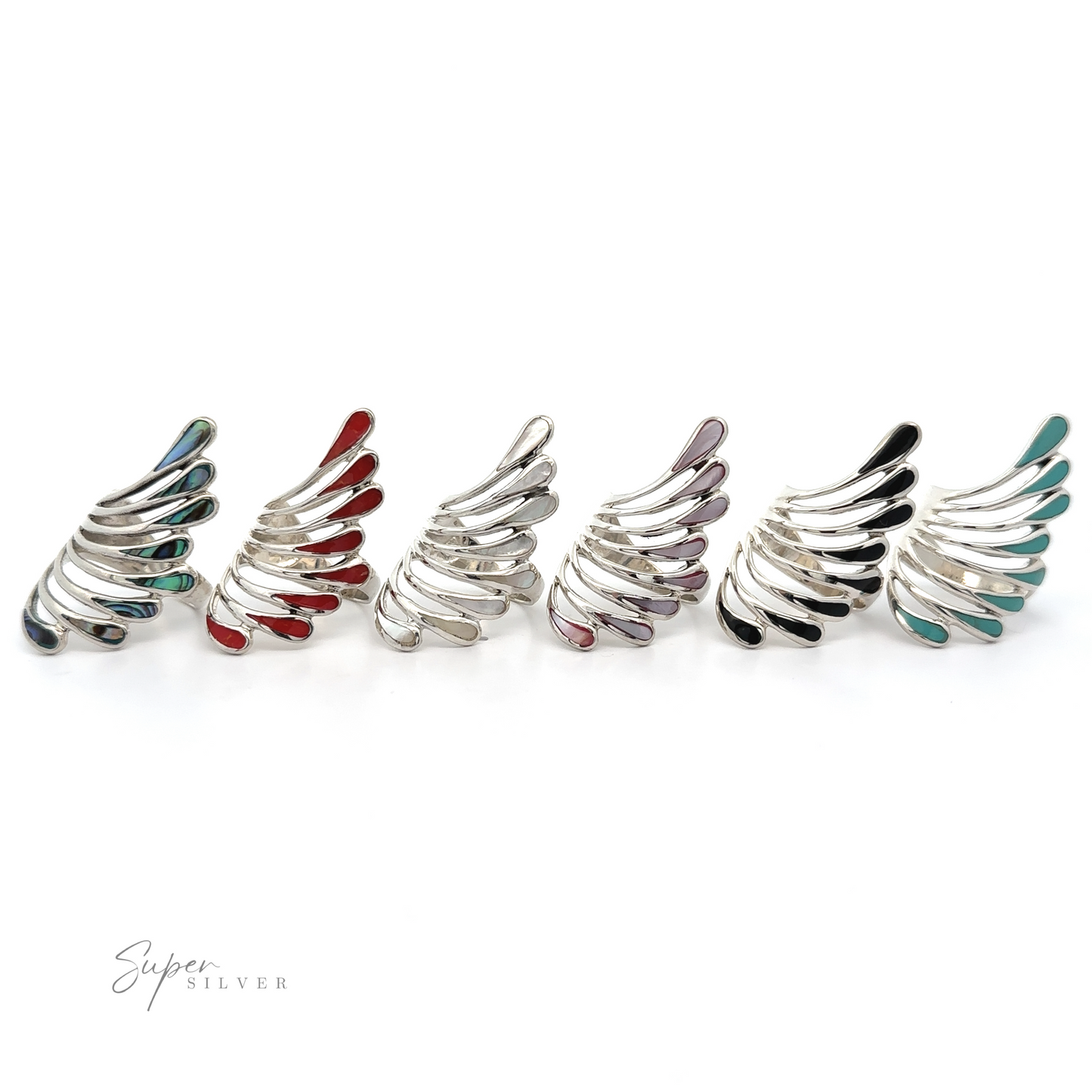 
                  
                    A row of Beautiful Inlay Stone Wing Fan Rings with shimmering colorful stones.
                  
                