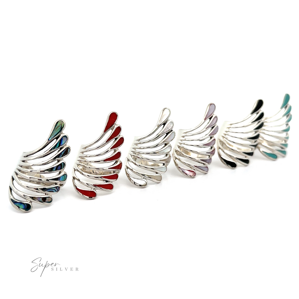 A row of Beautiful Inlay Stone Wing Fan Rings, captivating and enchanting treasures.