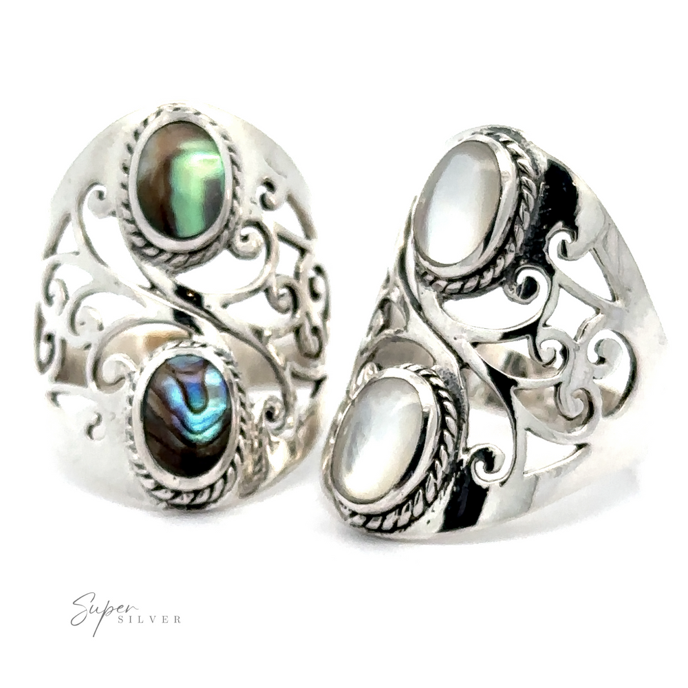 Two ornate silver rings with intricate filigree detailing from the 