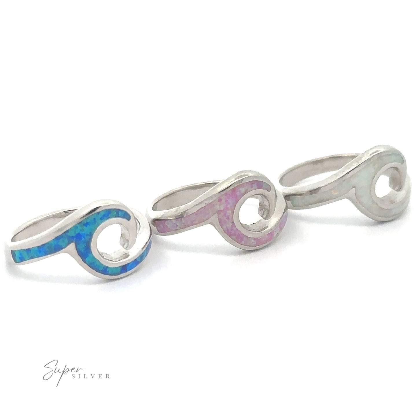 
                  
                    Three Lab-Created Opal Wave Bands with designs inlaid with blue and pink fire-opal materials.
                  
                