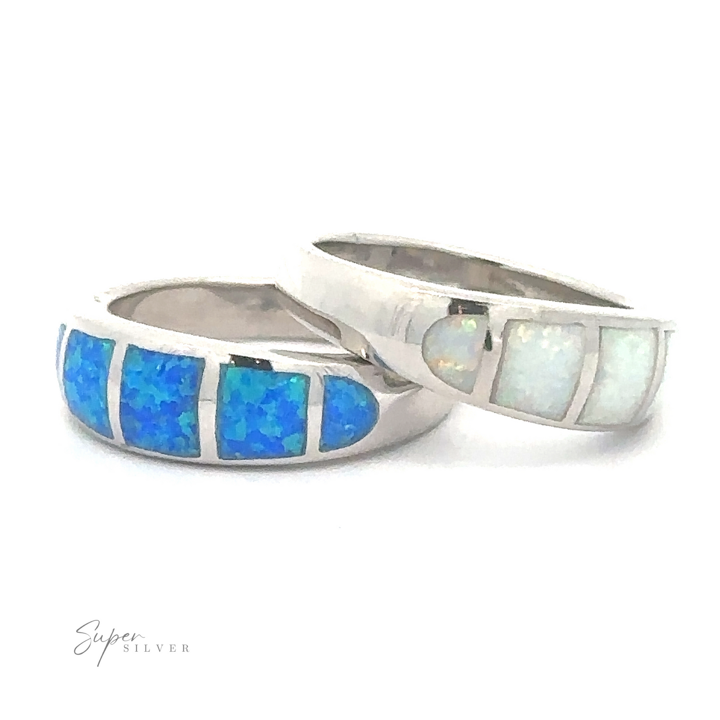 Two lightweight Tapered Lab-Opal Bands with inlaid blue and white gemstones, durable and versatile for everyday wear.