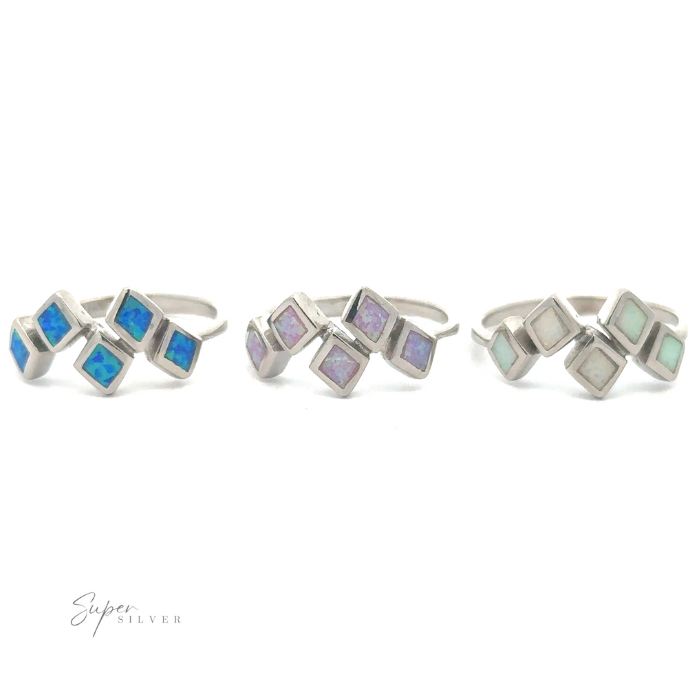 
                  
                    Three Diamond Pattern Lab-Created Opal rings with geometric inlays of lab-created opal in blue, purple, and green displayed on a white background.
                  
                