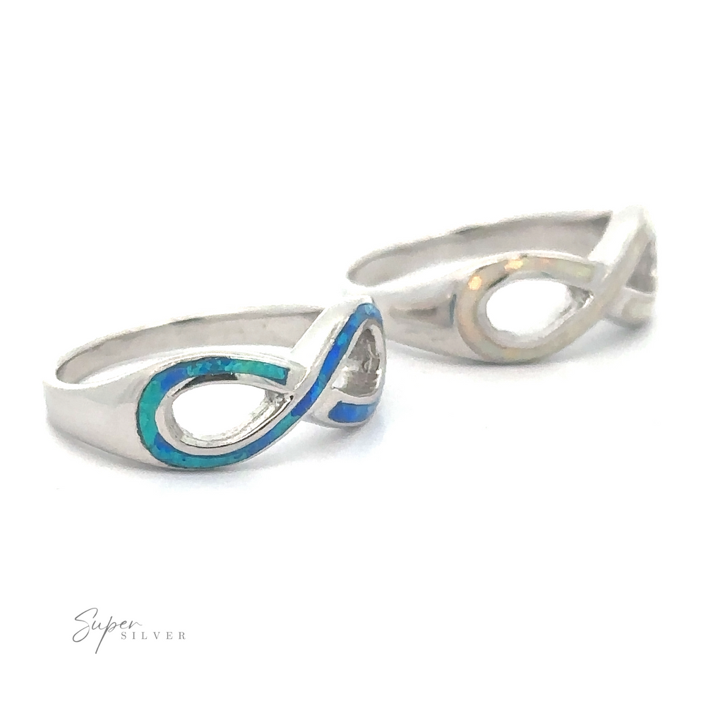 Two stylish silver Opal Infinity Rings, displayed against a white background.