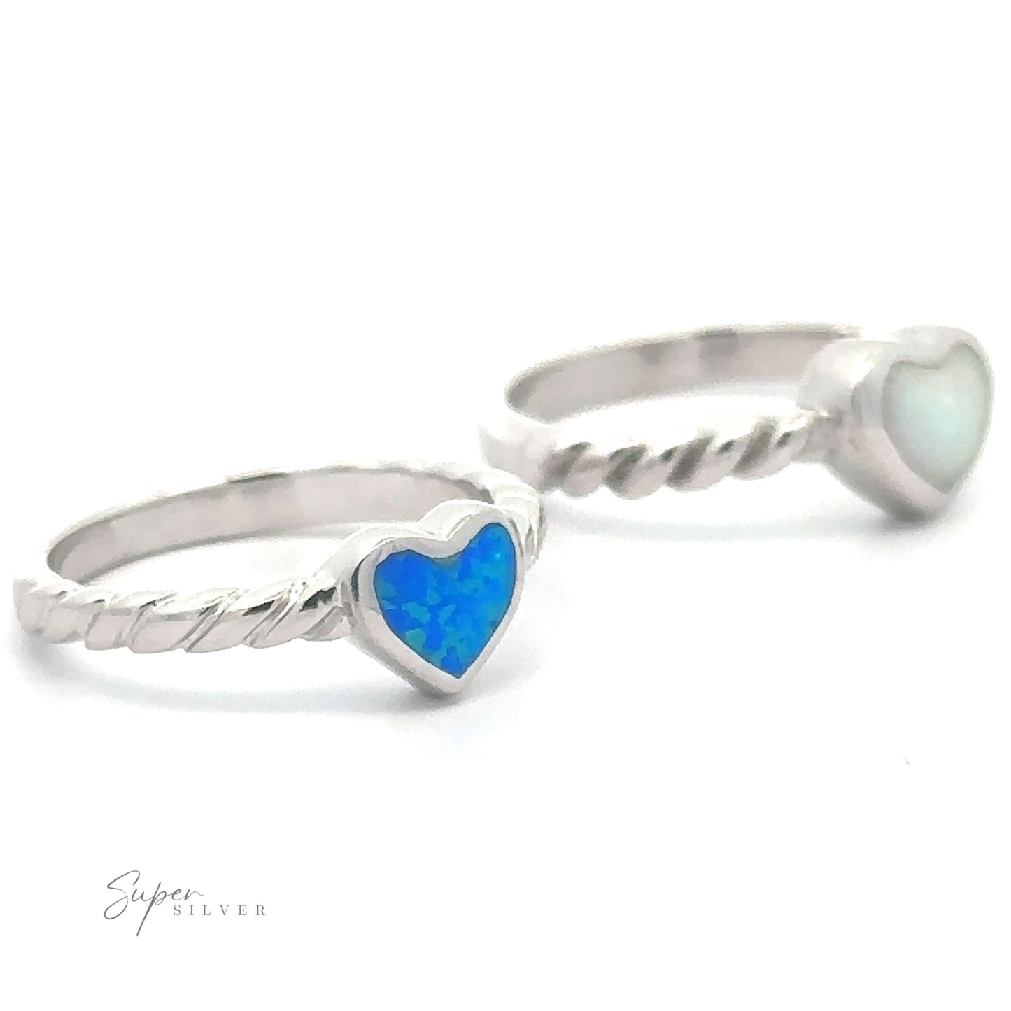 Two Lab Opal Heart Rings with Twisted Bands on a white background.