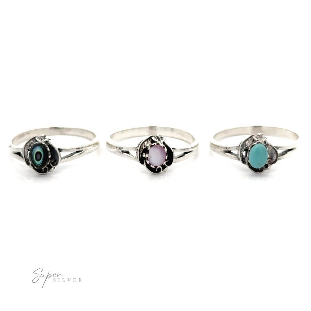 
                  
                    Three Stone Oval Rings With Delicate Detailing made with turquoise stones and abalone accents.
                  
                