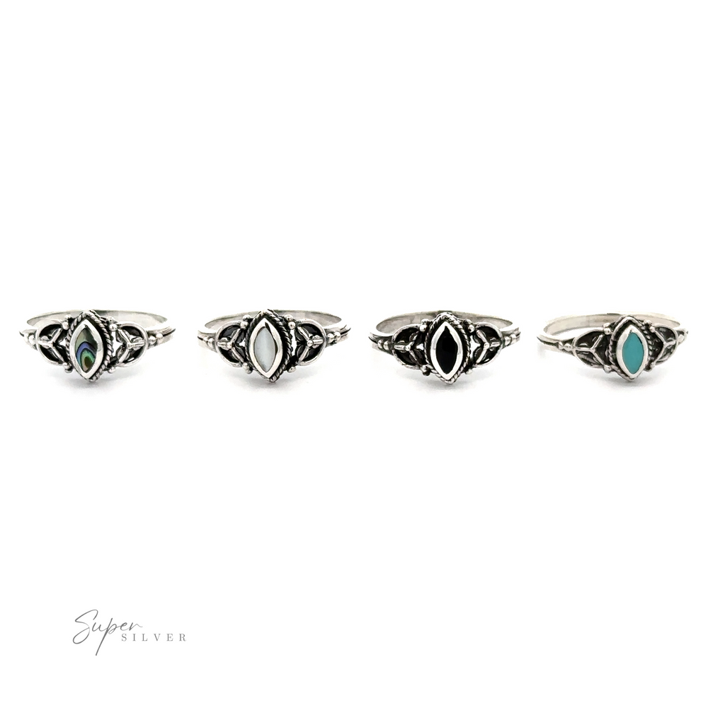A set of four fashionable Tiny Marquise Inlay Stone Rings with a vintage look and featuring turquoise stones.