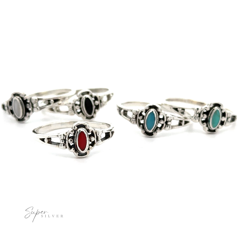 A collection of Oval Inlay Stone Rings adorned with oval stones in various colors.