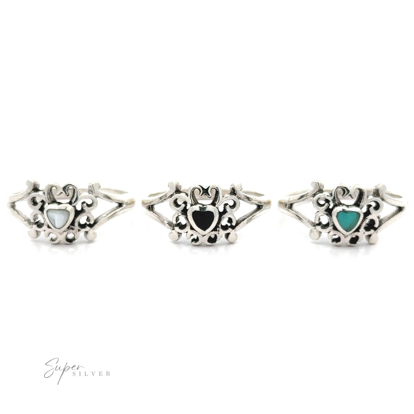 Three sterling silver rings with turquoise stones on them, featuring Filigree Design Surround Inlaid Stone Heart designs.