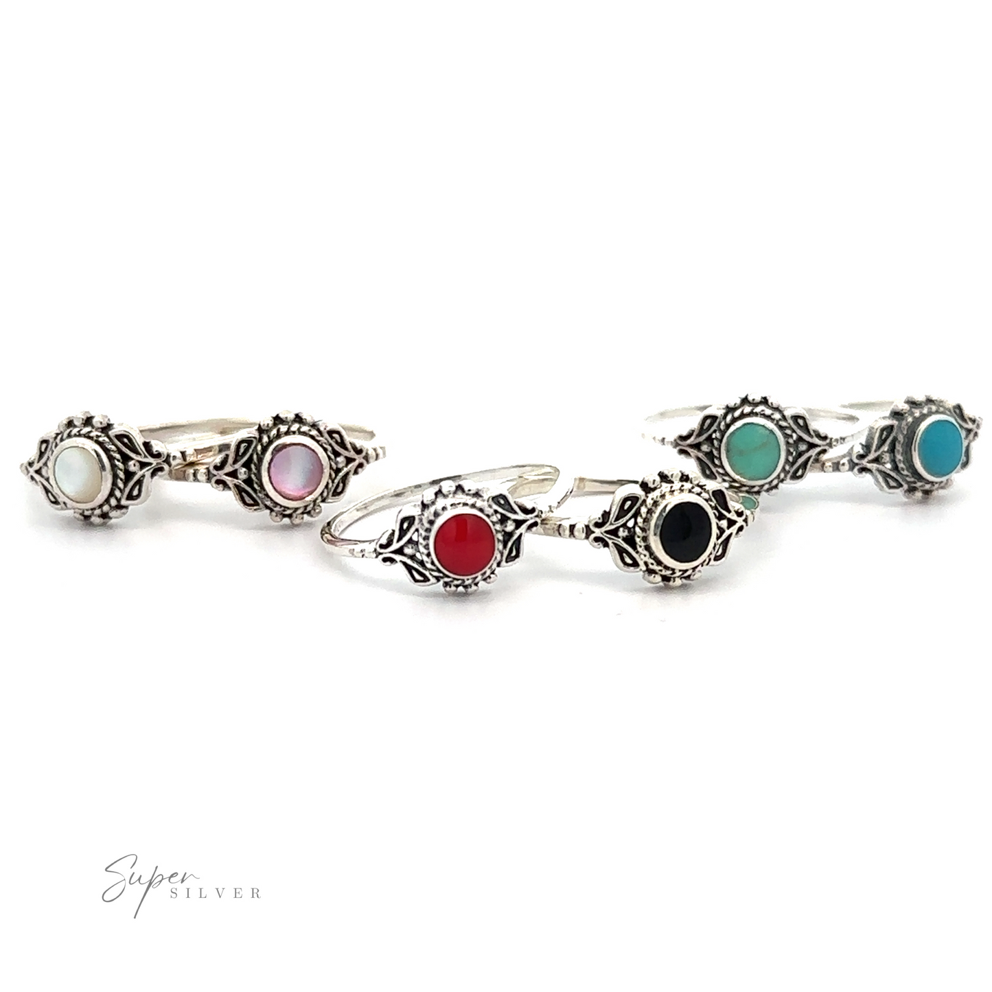 A set of Dainty Inlaid Stone Rings with Filigree in various colors.