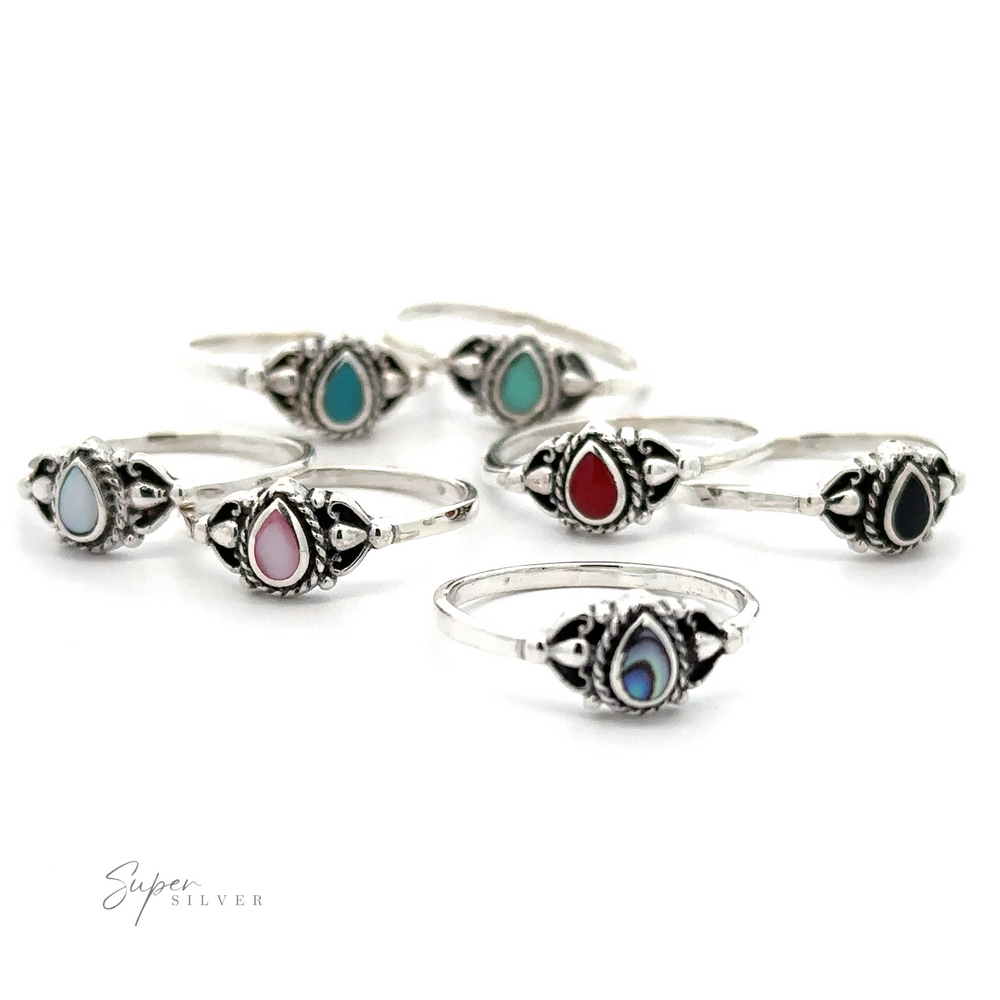 A set of Delicate Teardrop Inlay Stone Rings with Vintage Look inlaid turquoise stones.