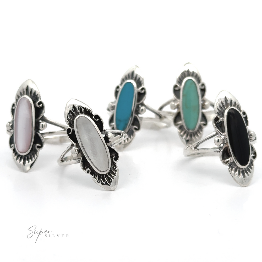 A set of four fashionable silver rings, including a stunning Southwest Inspired Elongated Oval Ring with an antique look.