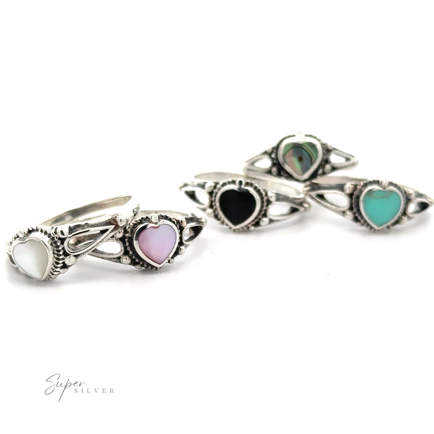 A collection of silver rings with various colored Inlaid Stone Heart Rings.