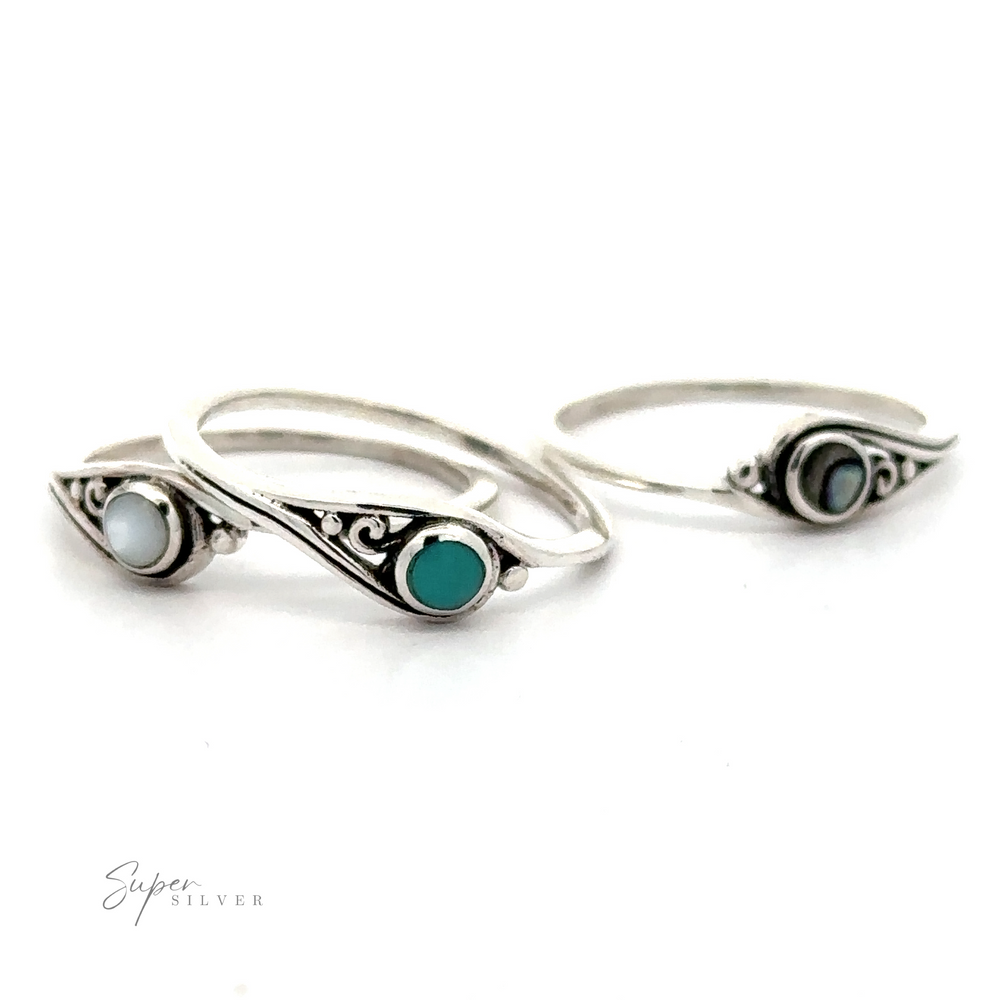 Three Delicate Inlay Stone Rings with Small Swirl Design, crafted from sterling silver.