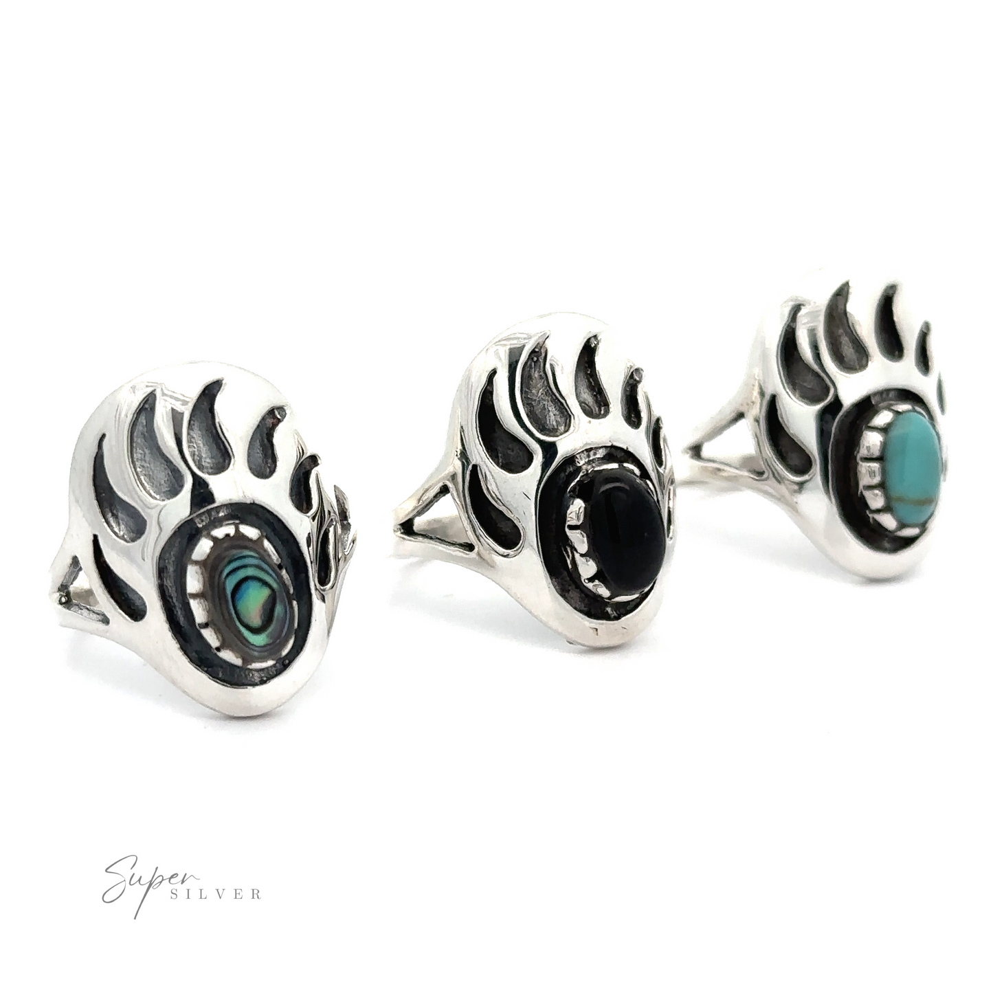 Three silver rings with turquoise stones, including one Stone Bear Paw ring.