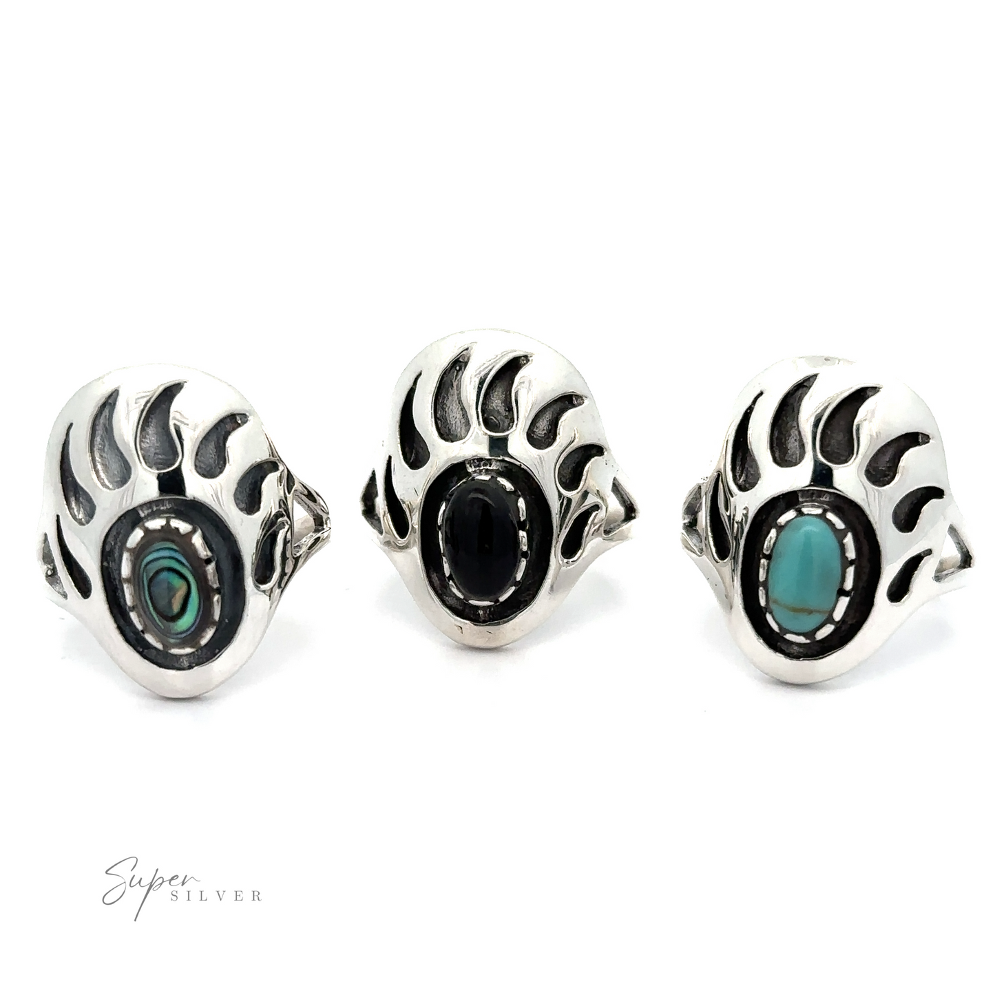 Three silver rings with turquoise stones on them, including a Stone Bear Paw ring.