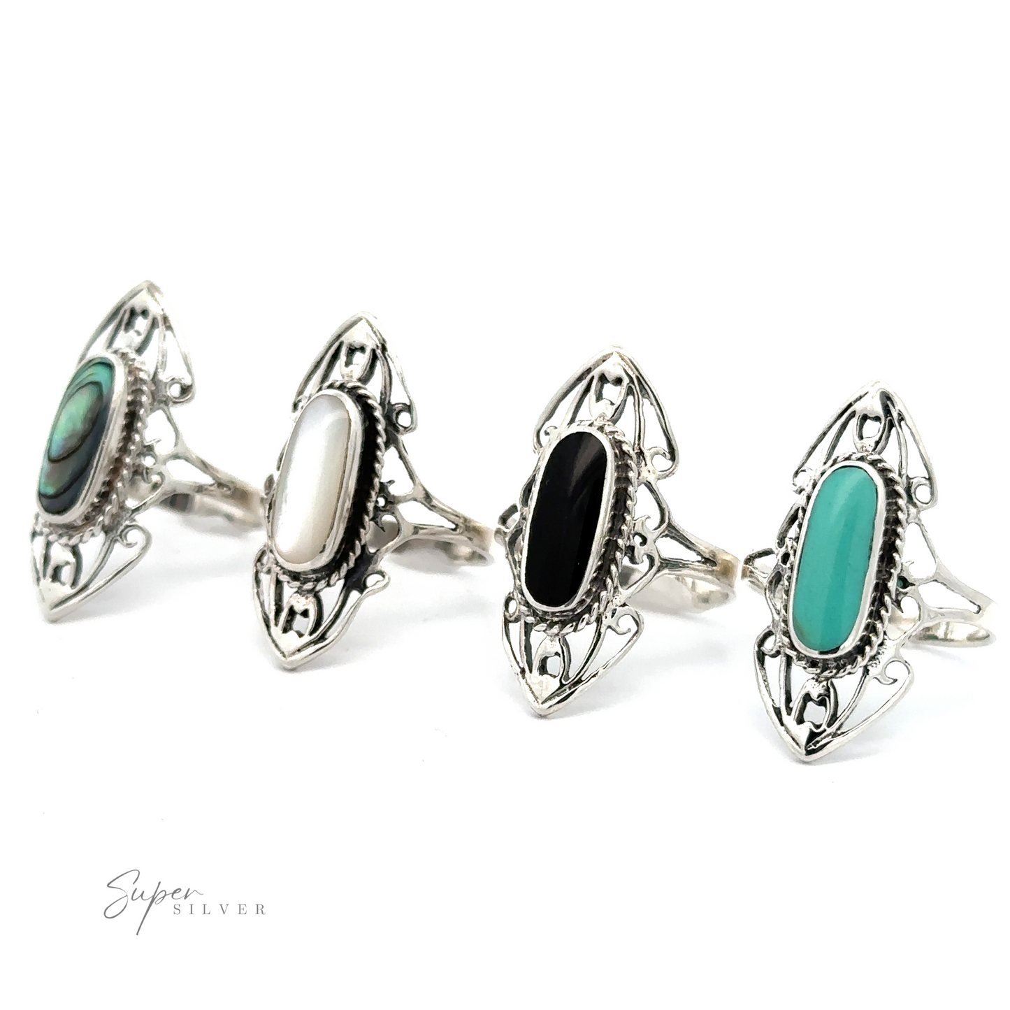 A collection of four Elongated Filigree Rings With Oval Inlaid Stones on a white background.
