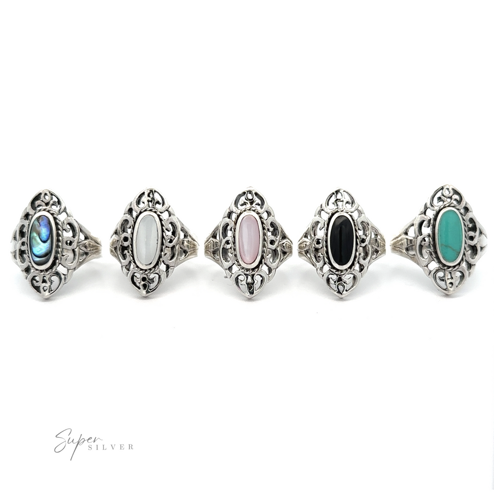 A collection of five Marquise Filigree Inlay Stone rings displayed in a row against a white background, radiating mesmerizing bohemian elegance.